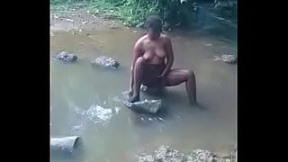 appealing african wife taking bath