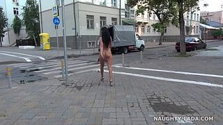 Completely without clothes in open space. Naked on city streets