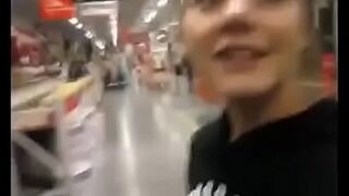 Excited girl gilrfriend sucking in a outdoors store